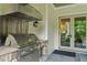 Outdoor kitchen with stainless steel grill and views of the backyard and access to indoors at 800 Lakestone Dr, Raleigh, NC 27609
