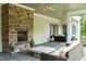 Inviting outdoor living space with stone fireplace and comfortable seating, perfect for entertaining at 800 Lakestone Dr, Raleigh, NC 27609