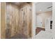 Stylish bathroom with a glass-enclosed shower featuring wood-look tile and modern fixtures at 800 Lakestone Dr, Raleigh, NC 27609