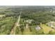 Community homes nestled among lush trees are captured in this scenic aerial view at 100 Virginia Lee Ln, Efland, NC 27243
