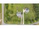 Aerial shot showing two homes with lush lawns and mature trees at 100 Virginia Lee Ln, Efland, NC 27243