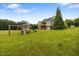 Large backyard featuring a playset, perfect for outdoor fun and recreation at 100 Virginia Lee Ln, Efland, NC 27243