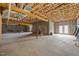 Unfinished basement featuring concrete floor, cinderblock walls and exposed ceiling at 100 Virginia Lee Ln, Efland, NC 27243