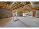 Unfinished basement with concrete floors, cinderblock walls, and exposed ceiling at 100 Virginia Lee Ln, Efland, NC 27243