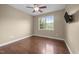 Cozy bedroom with hardwood floors, natural light, and a ceiling fan at 100 Virginia Lee Ln, Efland, NC 27243