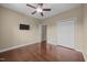 Bedroom with neutral walls, hardwood floors, closet and a television on the wall at 100 Virginia Lee Ln, Efland, NC 27243