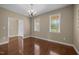 Light-filled dining room with hardwood floors and ample windows, offering neutral colors at 100 Virginia Lee Ln, Efland, NC 27243