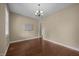 Dining room featuring hardwood floors, neutral paint and a modern chandelier at 100 Virginia Lee Ln, Efland, NC 27243