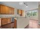 Well-lit kitchen featuring granite countertops, wooden cabinets, and modern stainless steel appliances at 100 Virginia Lee Ln, Efland, NC 27243