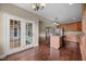 Open concept kitchen flowing into dining area, with wood floors and stainless steel appliances at 100 Virginia Lee Ln, Efland, NC 27243