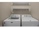 Laundry room featuring modern washer and dryer units, and built-in shelving at 100 Virginia Lee Ln, Efland, NC 27243