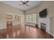 Open living room with hardwood floors and fireplace, seamlessly connected to the kitchen at 100 Virginia Lee Ln, Efland, NC 27243