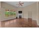 Open living room with fireplace and large windows, offering plenty of natural light at 100 Virginia Lee Ln, Efland, NC 27243