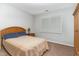 Bedroom with a light-colored bed, neutral walls, and carpet flooring at 1001 Kingsway Dr, Apex, NC 27502