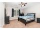Bedroom featuring a dark wood bed frame, black dressers, and carpet flooring at 1001 Kingsway Dr, Apex, NC 27502