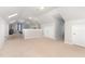 Large bonus room with neutral carpet, light walls, and multiple access points, ideal for flexible living at 1001 Kingsway Dr, Apex, NC 27502