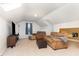 Cozy loft living room with neutral carpet, a ceiling light, a large window, a tv, and comfortable seating at 1001 Kingsway Dr, Apex, NC 27502