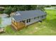 Charming single-story home with a well-maintained lawn and inviting new covered back porch at 1006 S Second Ave Ave, Siler City, NC 27344