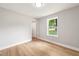 An empty bedroom with hardwood floors, natural lighting, and neutral colored walls at 1006 S Second Ave Ave, Siler City, NC 27344
