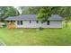 Well-kept single-story home featuring new siding and a spacious backyard with a deck at 1006 S Second Ave Ave, Siler City, NC 27344