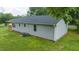 Charming single-story home featuring a well-maintained lawn and newly installed siding at 1006 S Second Ave Ave, Siler City, NC 27344