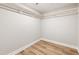 A bright walk-in closet featuring hardwood floors and white wrap-around shelving at 1006 S Second Ave Ave, Siler City, NC 27344
