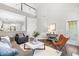 Open living room featuring high ceilings, adjacent kitchen and lots of natural light at 1007 Epiphany Rd, Morrisville, NC 27560