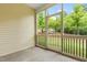 Screened-in porch offering a relaxing outdoor space with views of the lush backyard and greenery at 1007 Epiphany Rd, Morrisville, NC 27560