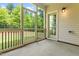 Inviting screened-in porch with access to backyard, providing a tranquil outdoor space for relaxation at 1007 Epiphany Rd, Morrisville, NC 27560