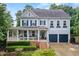 Charming two-story home with a welcoming front porch and well-maintained landscaping at 101 Ironcreek Pl, Apex, NC 27539