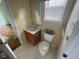 Bathroom featuring a vanity, toilet, and window at 101 New Castle Ct, Youngsville, NC 27596