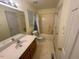 Bathroom with a single sink vanity, a large mirror, and a tub-shower combo at 101 New Castle Ct, Youngsville, NC 27596