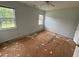 Spacious bedroom featuring natural light, ceiling fan, and large windows at 101 New Castle Ct, Youngsville, NC 27596