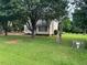 Charming home surrounded by mature trees and a green lawn, offering a peaceful and inviting setting at 101 New Castle Ct, Youngsville, NC 27596