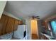 Traditional kitchen with wooden cabinets, white appliances, and an eat-in bar at 101 New Castle Ct, Youngsville, NC 27596