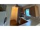 Traditional kitchen with wooden cabinets, white appliances, and an eat-in bar at 101 New Castle Ct, Youngsville, NC 27596