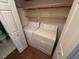 Convenient laundry room with a washer, dryer, and storage shelves, providing functionality and organization at 101 New Castle Ct, Youngsville, NC 27596