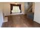 Bright living room with wood floors and a fireplace, offering a cozy and inviting space for relaxation at 101 New Castle Ct, Youngsville, NC 27596