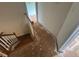 Staircase with wooden railings leading to the second floor at 101 New Castle Ct, Youngsville, NC 27596