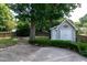 Backyard features a wooden deck, storage shed, mature trees, and a fire pit at 101 Stefi Ct, Garner, NC 27529