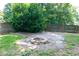 Backyard featuring a brick fire pit and wood privacy fence at 101 Stefi Ct, Garner, NC 27529