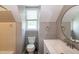 A full bathroom showcasing a sink, mirror, toilet, and natural light coming through the window at 101 Stefi Ct, Garner, NC 27529