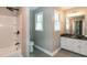 Bathroom featuring gray tile, vanity, and a shower/tub combo at 101 Stefi Ct, Garner, NC 27529