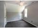 Neutral bedroom featuring a ceiling fan, window, and gray carpet at 101 Stefi Ct, Garner, NC 27529