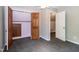 Bedroom featuring an open closet area, carpeted flooring, and a view through the doorway at 101 Stefi Ct, Garner, NC 27529