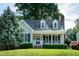 Charming single-Gathering home featuring a cozy front porch and well-maintained landscaping at 101 Stefi Ct, Garner, NC 27529