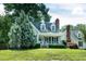 Picturesque home with a cozy front porch, complemented by a lush green lawn and mature trees at 101 Stefi Ct, Garner, NC 27529