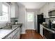 Kitchen featuring stainless steel appliances and white cabinetry at 101 Stefi Ct, Garner, NC 27529