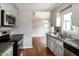 Well-lit kitchen with stainless steel appliances and stone countertops at 101 Stefi Ct, Garner, NC 27529