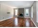 Bright and airy living room with hardwood floors and a charming brick fireplace at 101 Stefi Ct, Garner, NC 27529